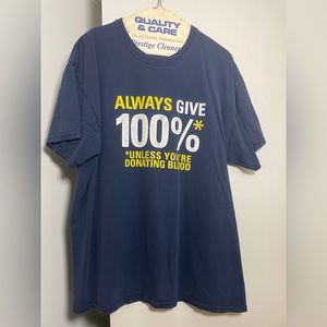 * L blue “Always Give 100%” graphic tee